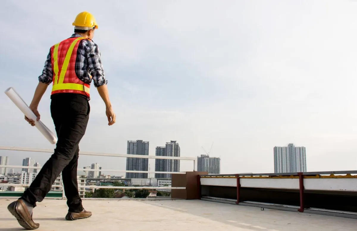 roofing expert walking on roof