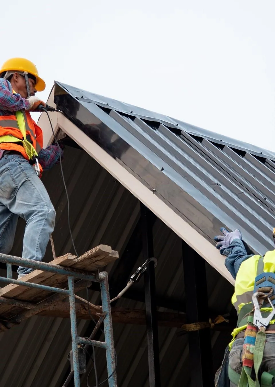 expert roofers working on commercial roof