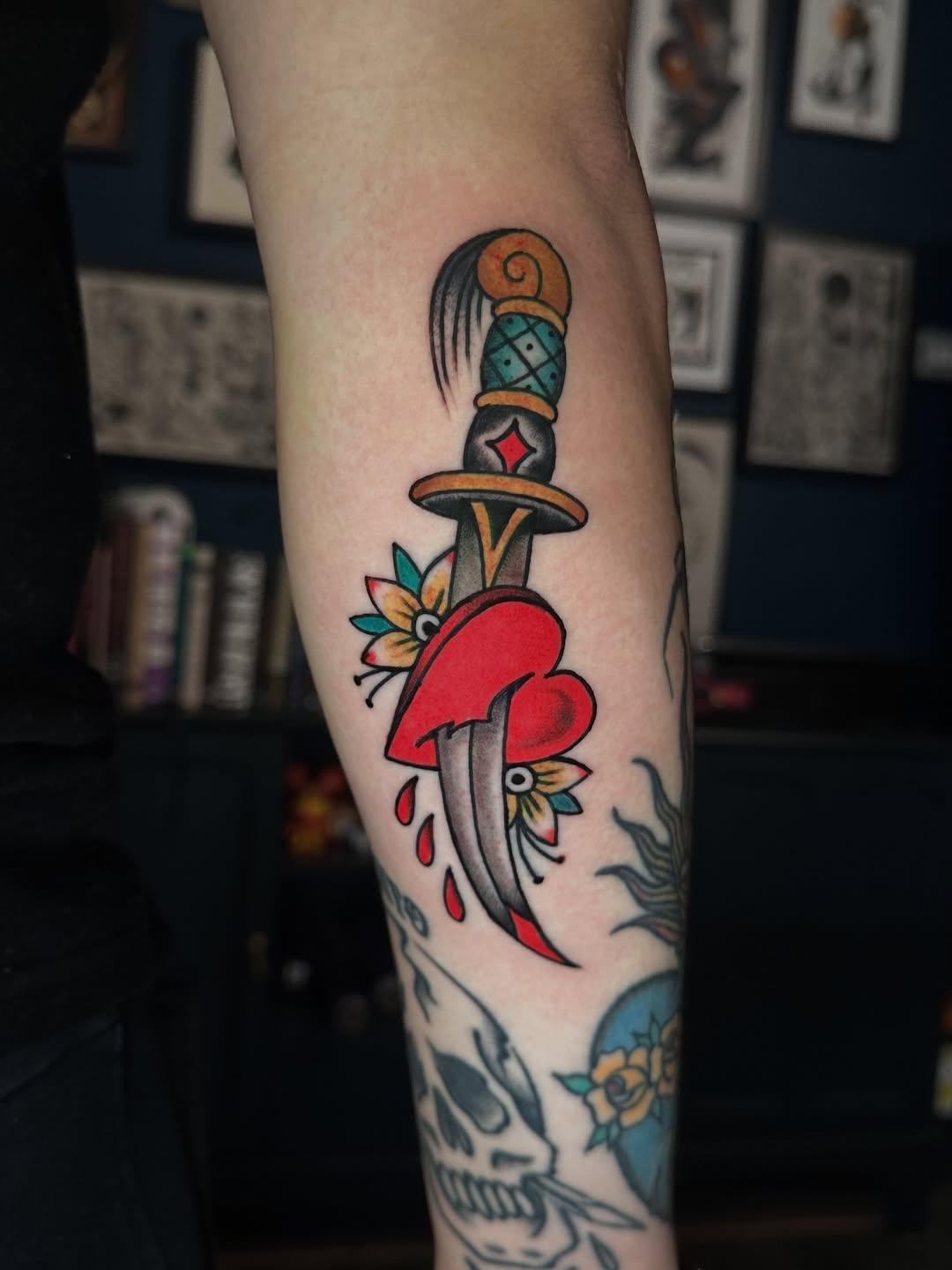 person with tattoo on right arm