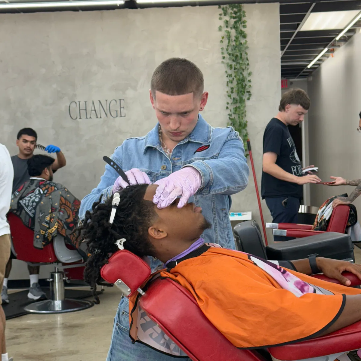 Barber cutting coarse hair using the straight razor