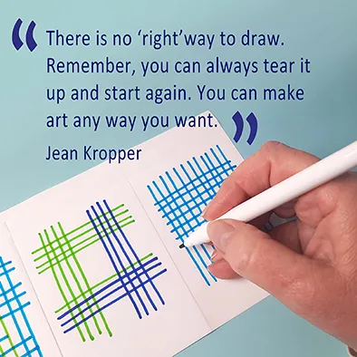 A close-up of a hand drawing intersecting blue and green lines with a white pen on a notecard, alongside a quote from Jean Kropper: 'There is no ‘right’ way to draw. Remember, you can always tear it up and start again. You can make art any way you want.
