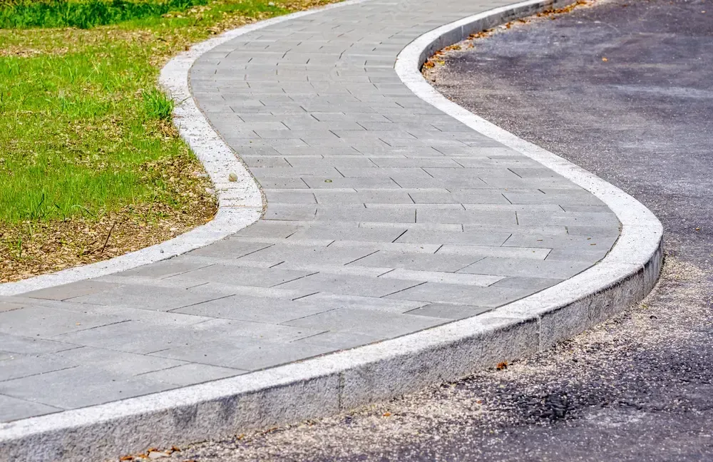 Picture of a skilled fence installer securing a chain-link fence - "Professional fence installer setting up a chain-link fence."