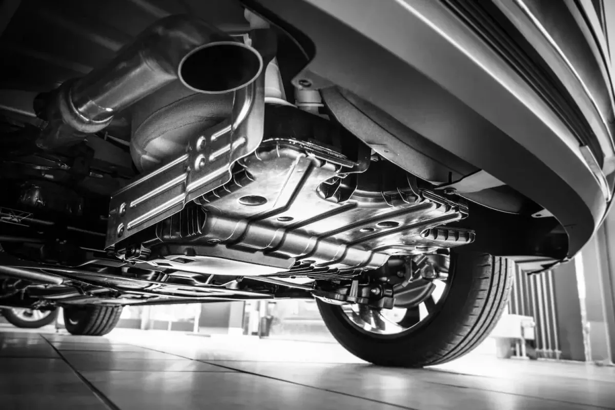 The exhaust of a car that needs an auto repair at T J Auto & Tire in Richmond