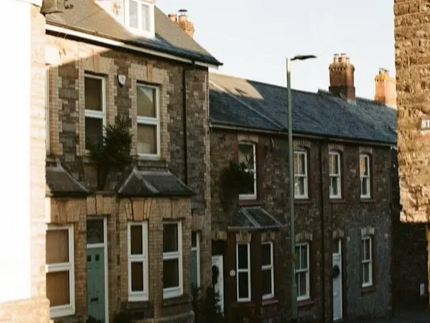 Traditional stone terraced houses on a British residential street