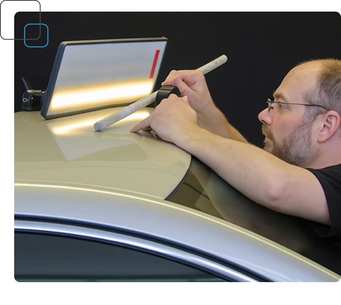 mobile paintless dent repair technician in action