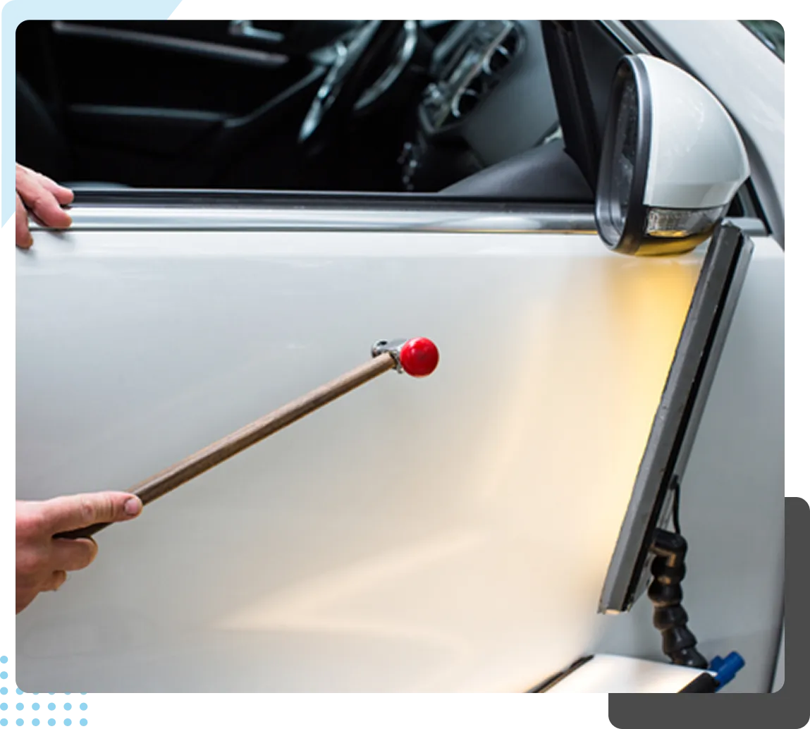 pdr technician repairing door dings