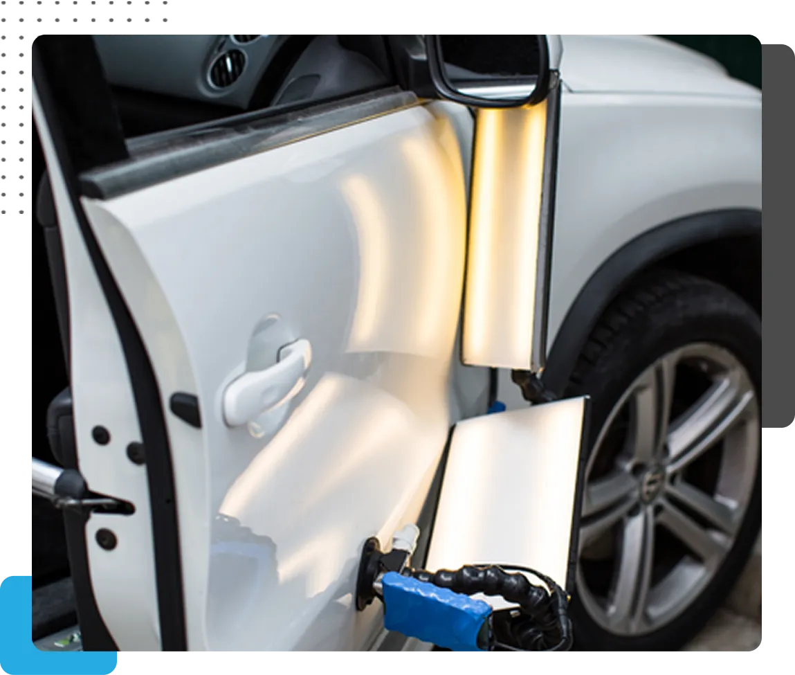 pdr technician repairing door dings