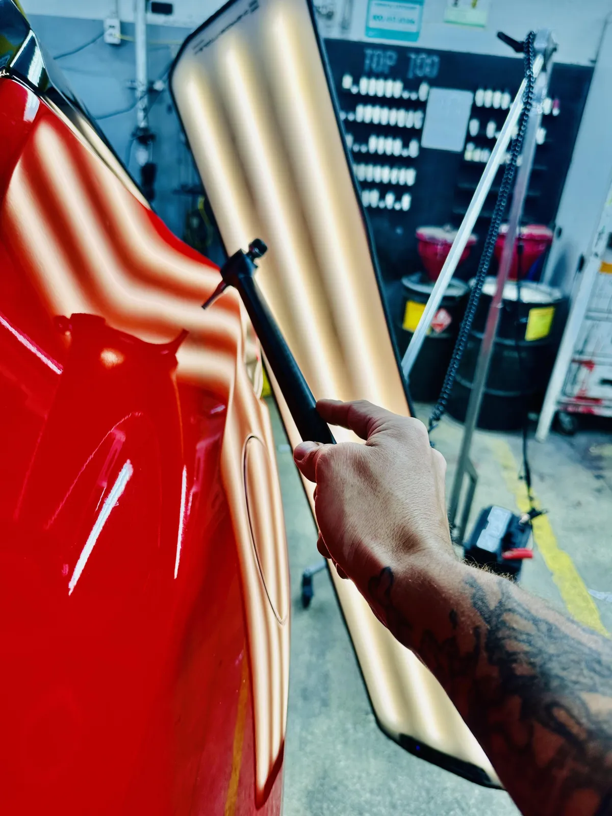 automotive hail repair, PDR on the roof of a vehicle