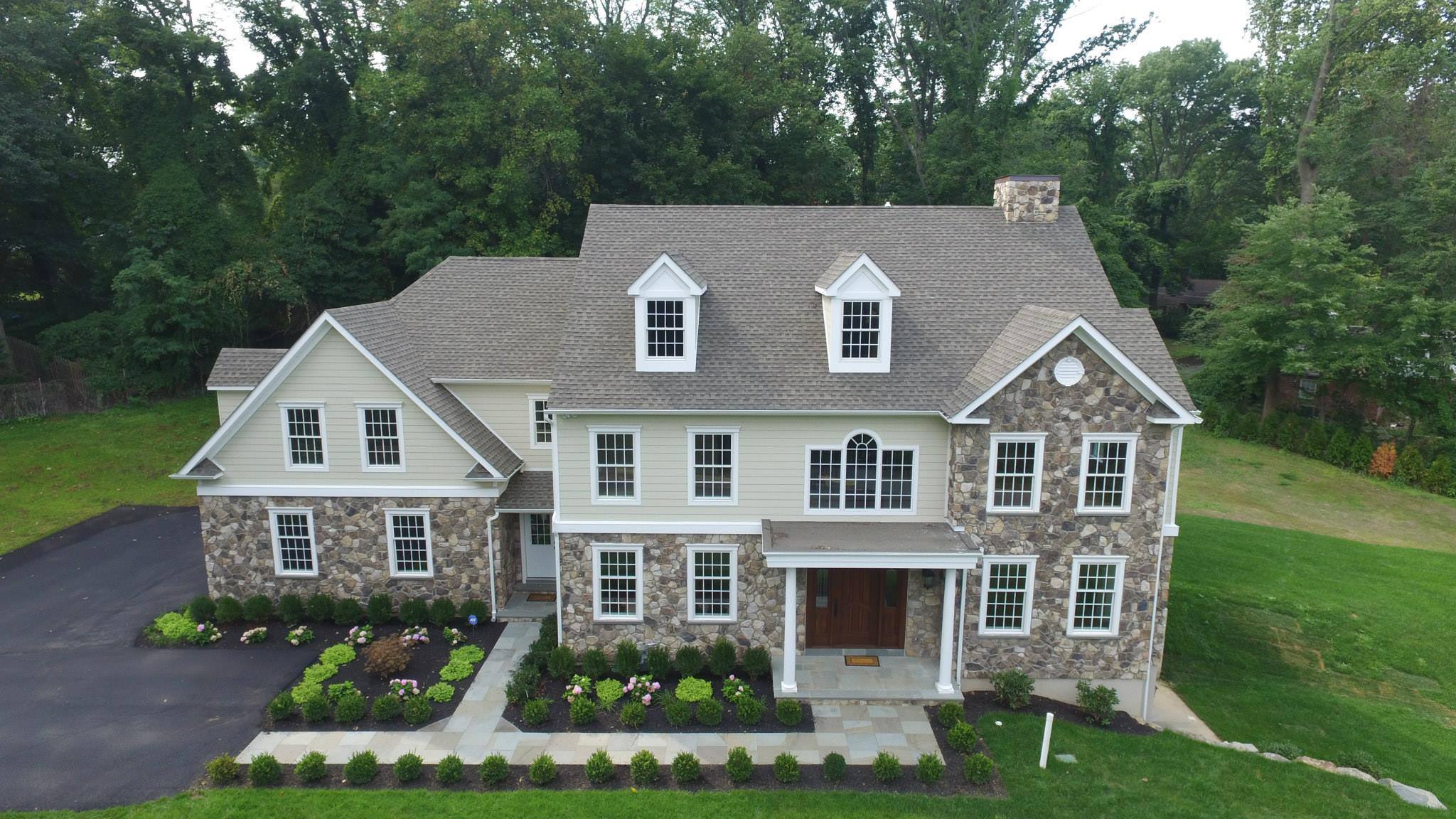 Home with siding and roofing