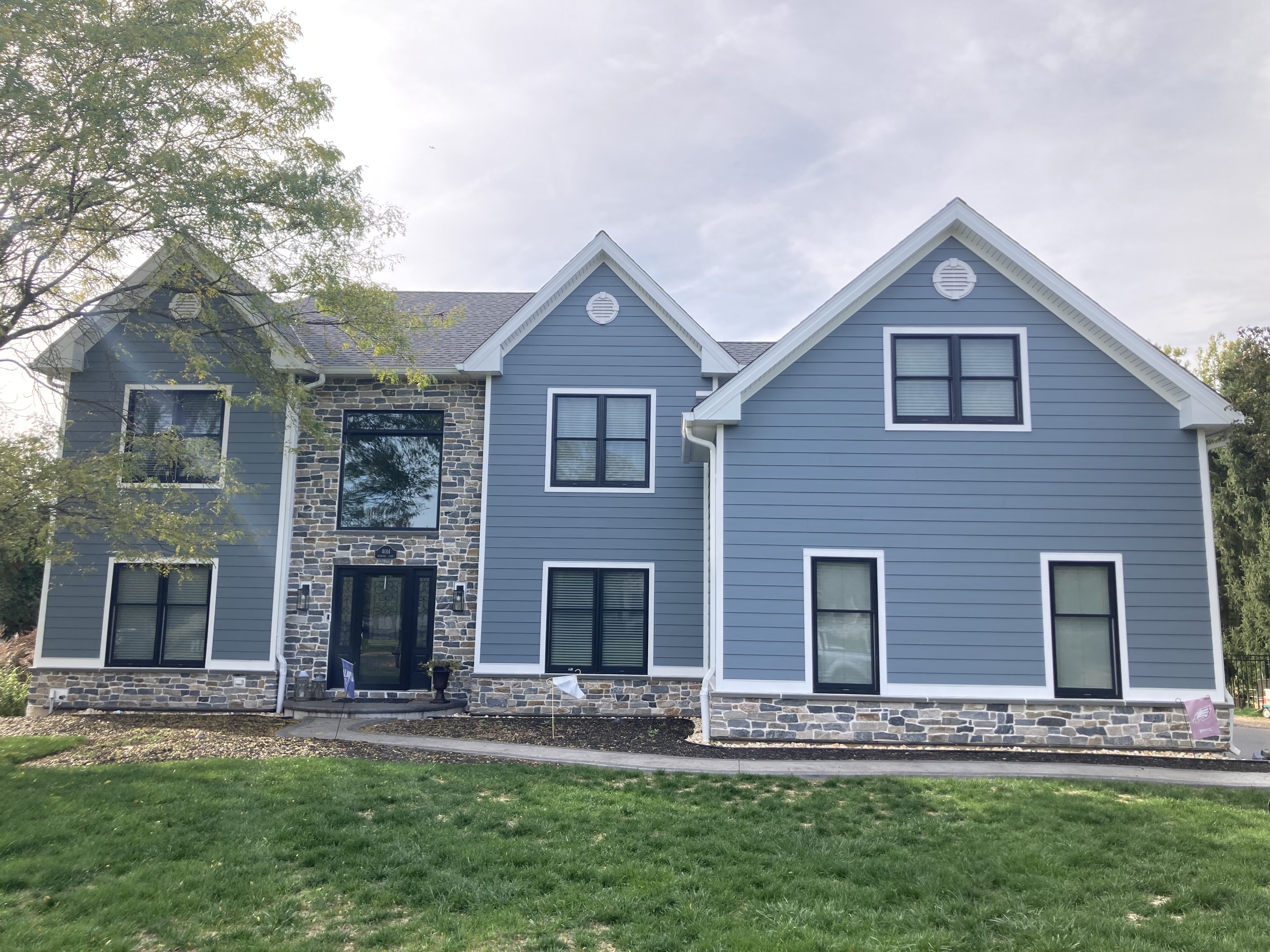 Two triangular dormer windows on a tiled roof.