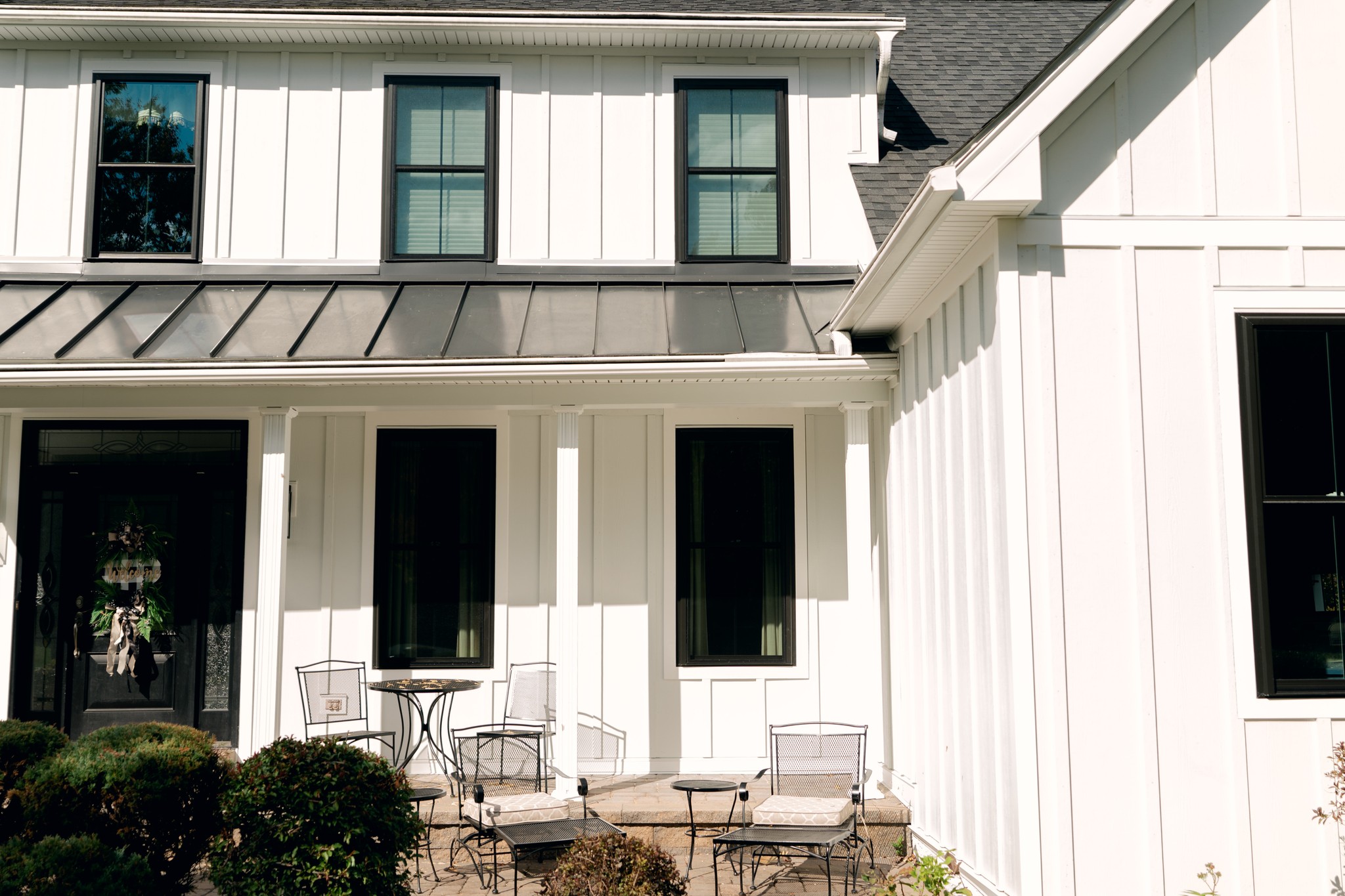 Two triangular dormer windows on a tiled roof.