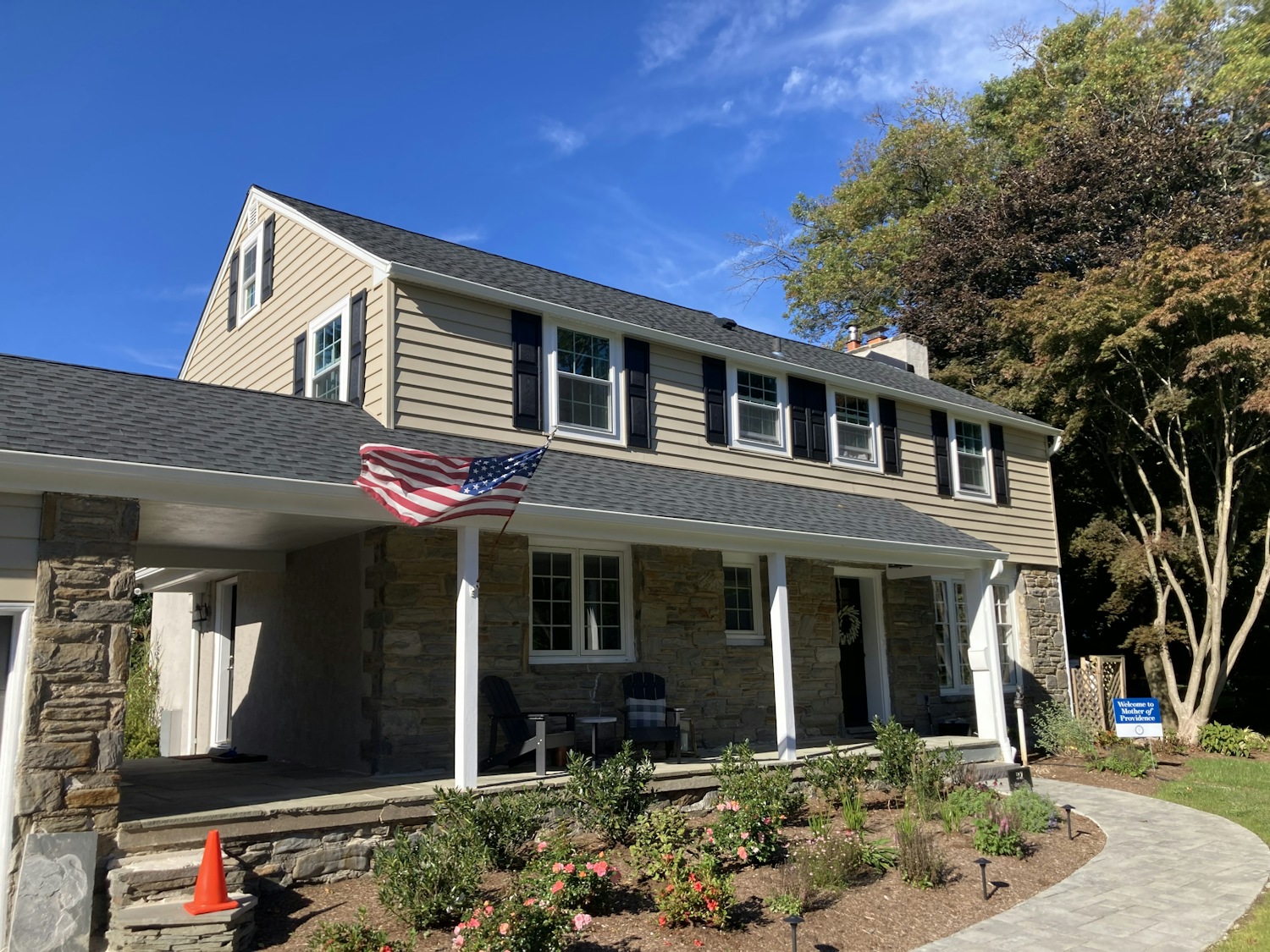 Two triangular dormer windows on a tiled roof.