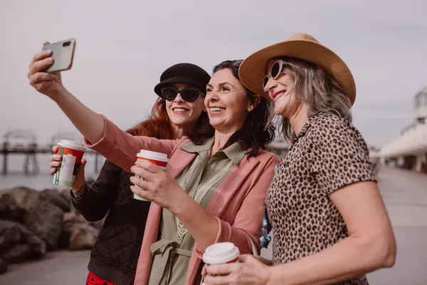 Group of adult women friends laughing together, representing adult friendship and connection