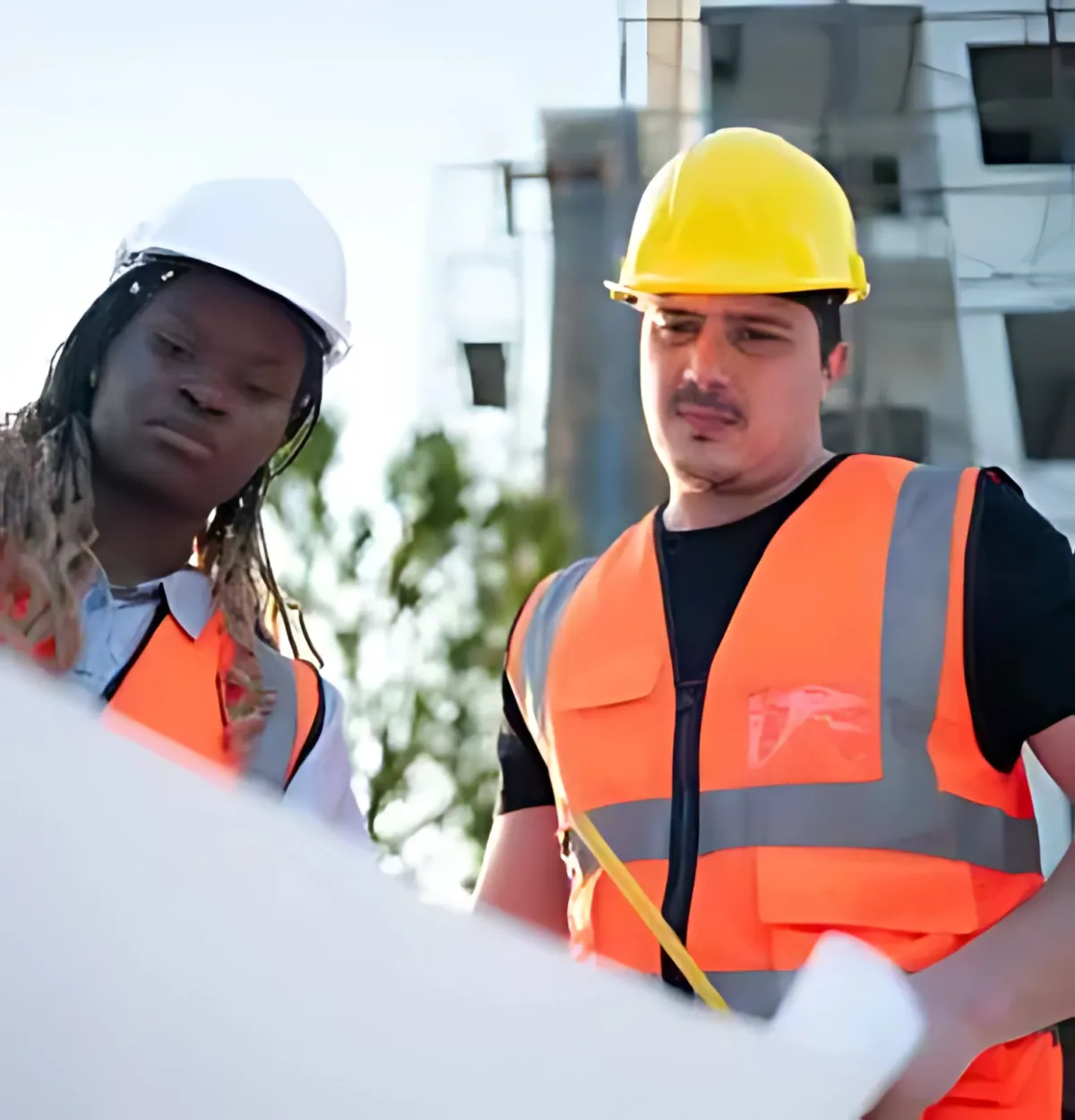 Burns Construction Solutions team discussing project plans at a construction site