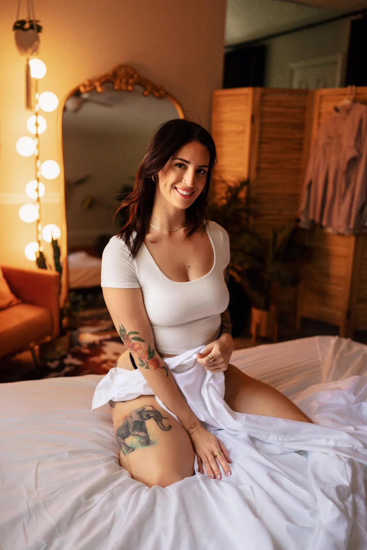 a bush with white flowers in a garden