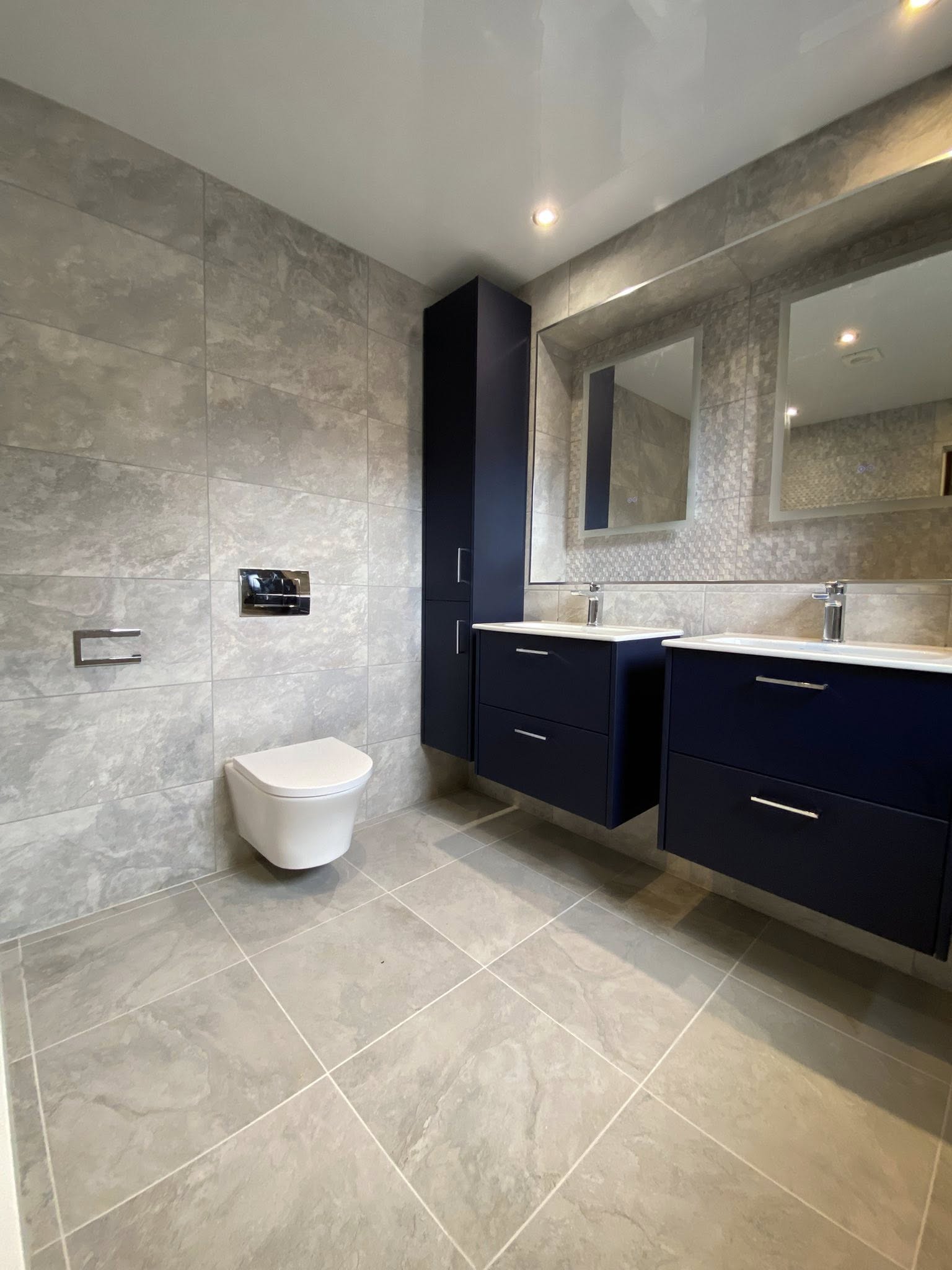 New bathroom installation completed in Dundee with blue cabinets