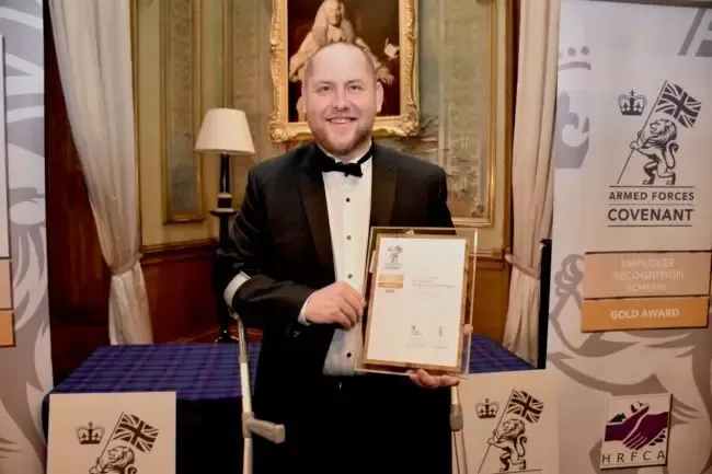 Founder holding Employer Recognition Scheme Bronze Award