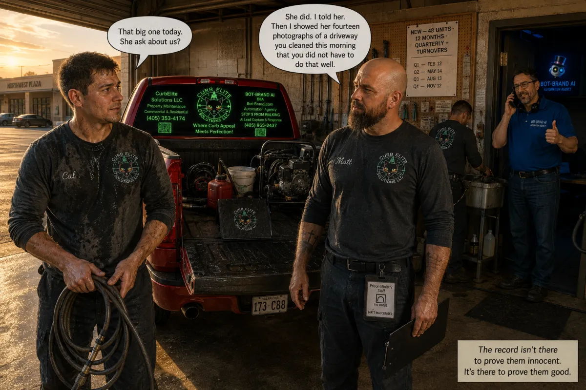 Two Curb Elite Solutions crew members talking at the shop bay tailgate at sunset in Northwest OKC, reviewing the fourteen job photographs documented from a driveway that morning.
