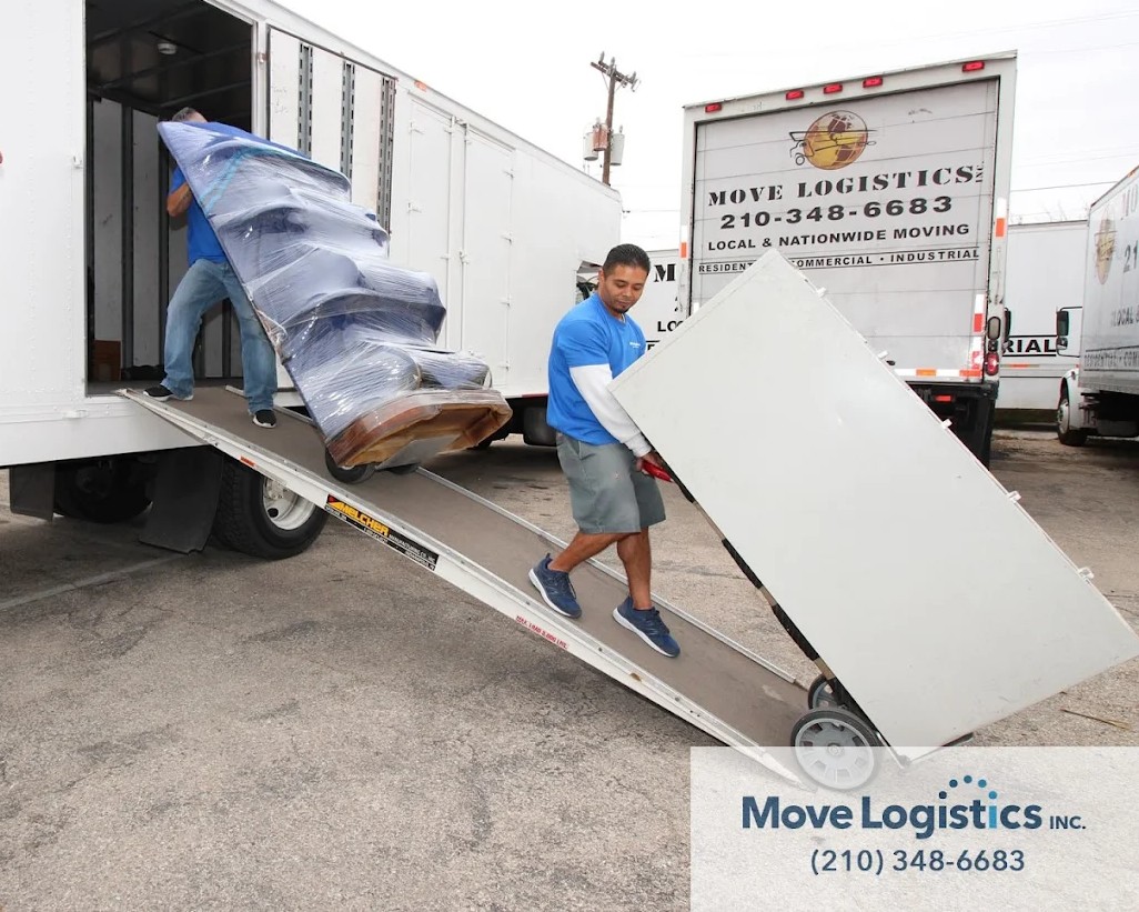 Move Logistics crew members safely loading iterms into the truck