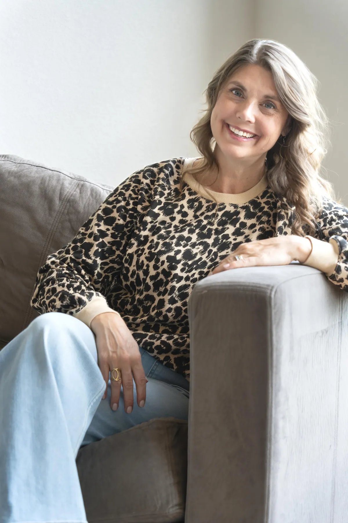 Brie sitting on a sofa