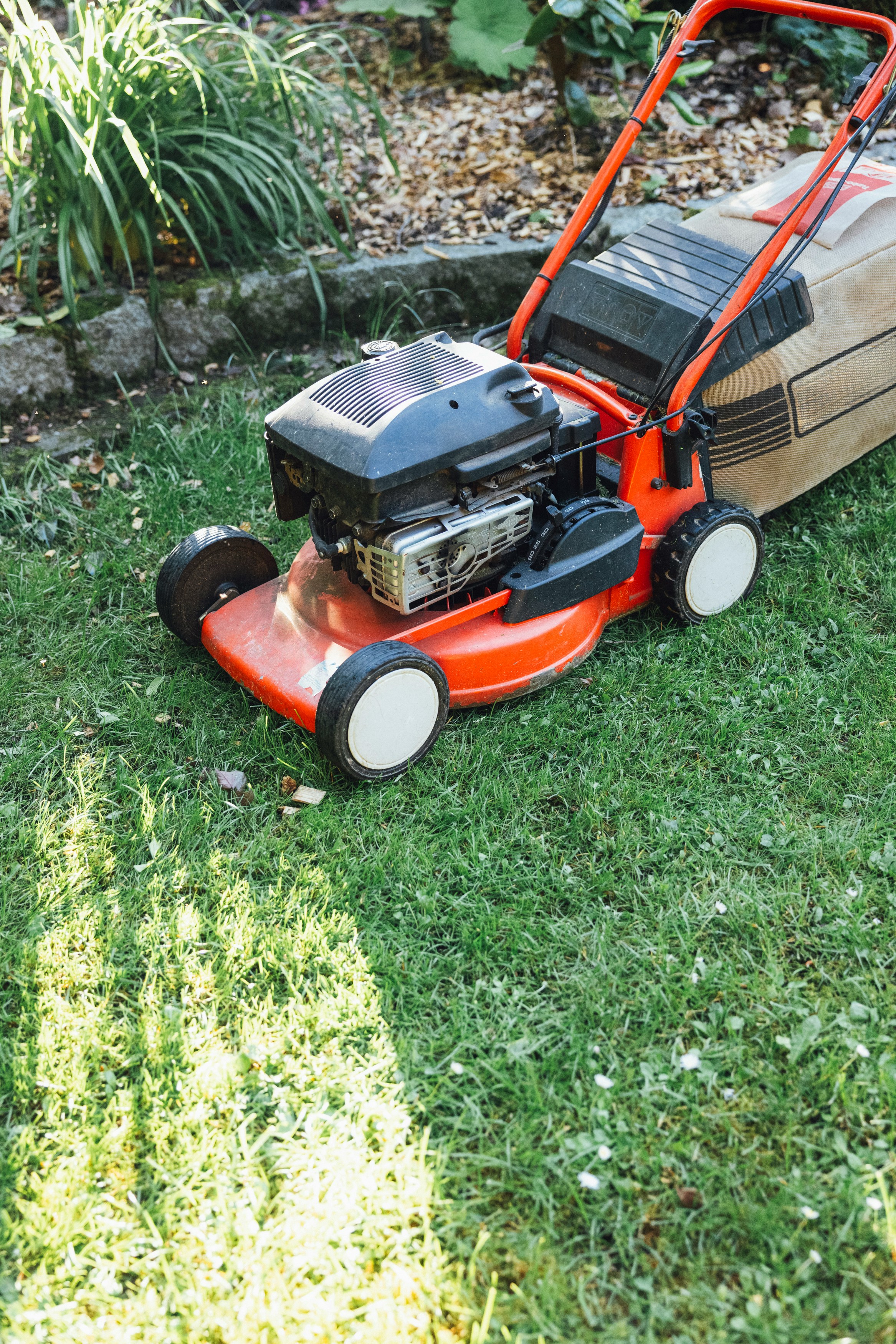 red lawn mower on grass