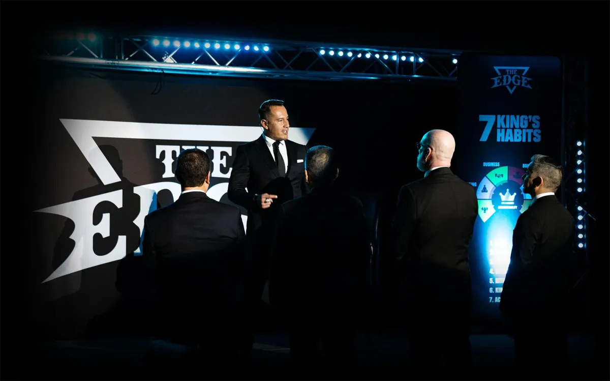 raul villacis founder of the EDGE program coaching a group of high level businessmen from Stage