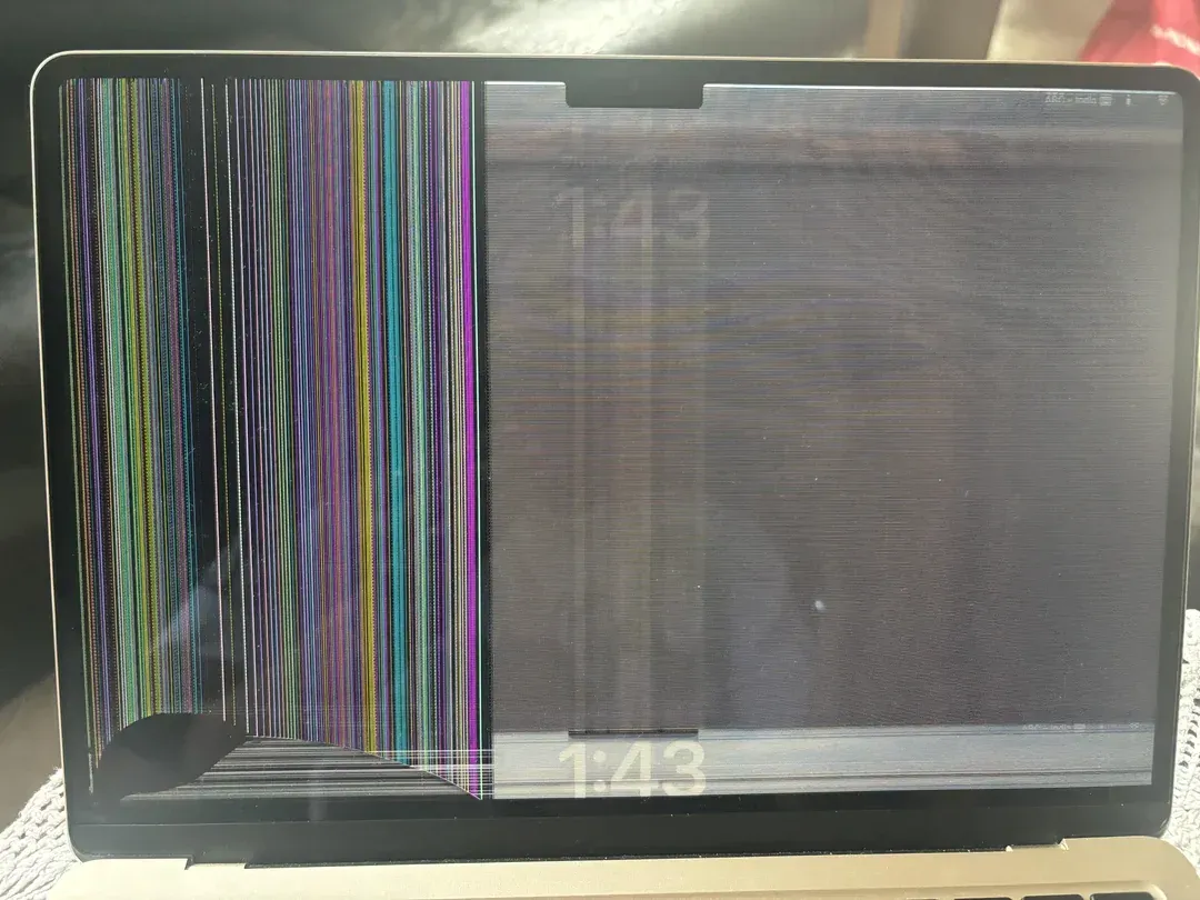 Technician performing laptop data recovery using external hard drive at a repair desk in Hawaii.