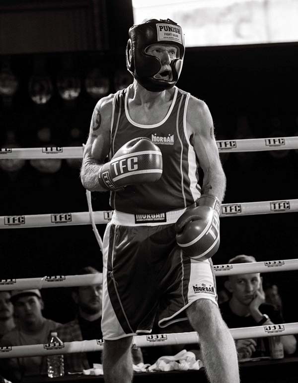 Stark portrait of David boxing in high contrast