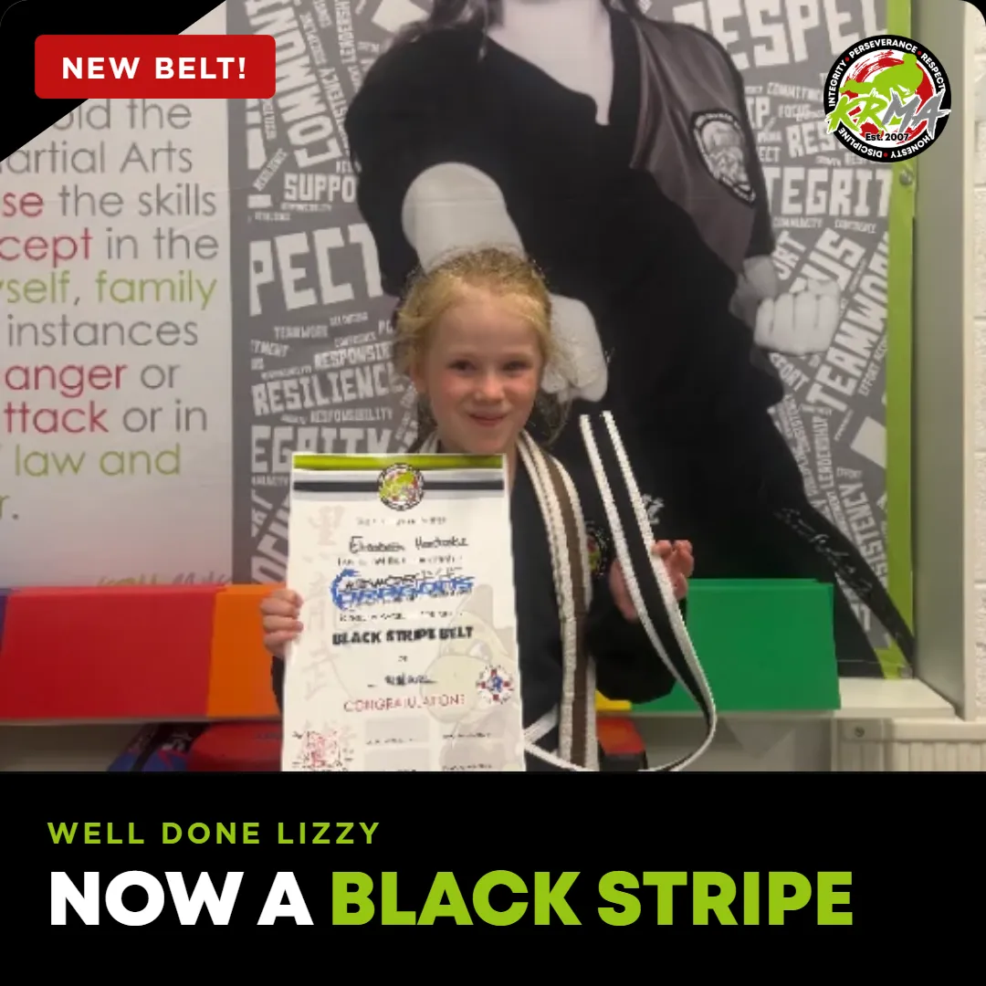 Lizzy celebrating a new belt at KRMA