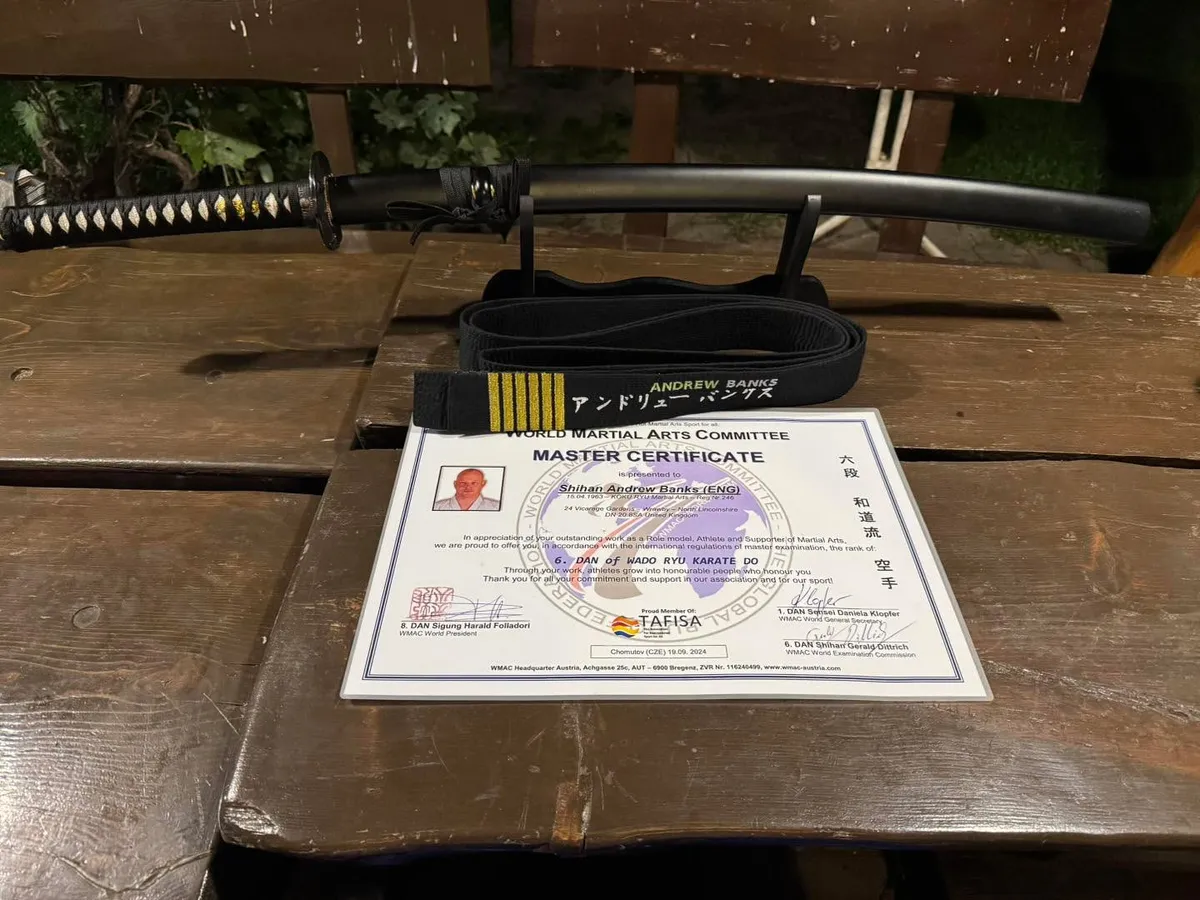 Andrew Banks receiving his 6th Dan recognition at the WMAC World Championships 2024