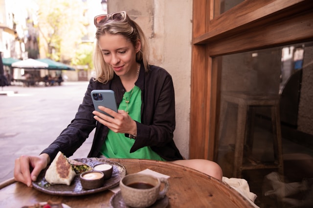 Restaurant customer checking Google reviews on smartphone