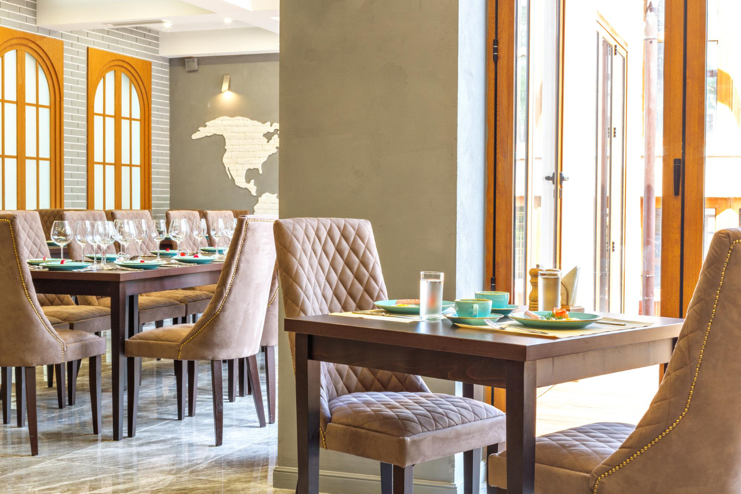 A restaurant operator walking through a dining room evaluating layout and flow to improve guest experience and profitability.