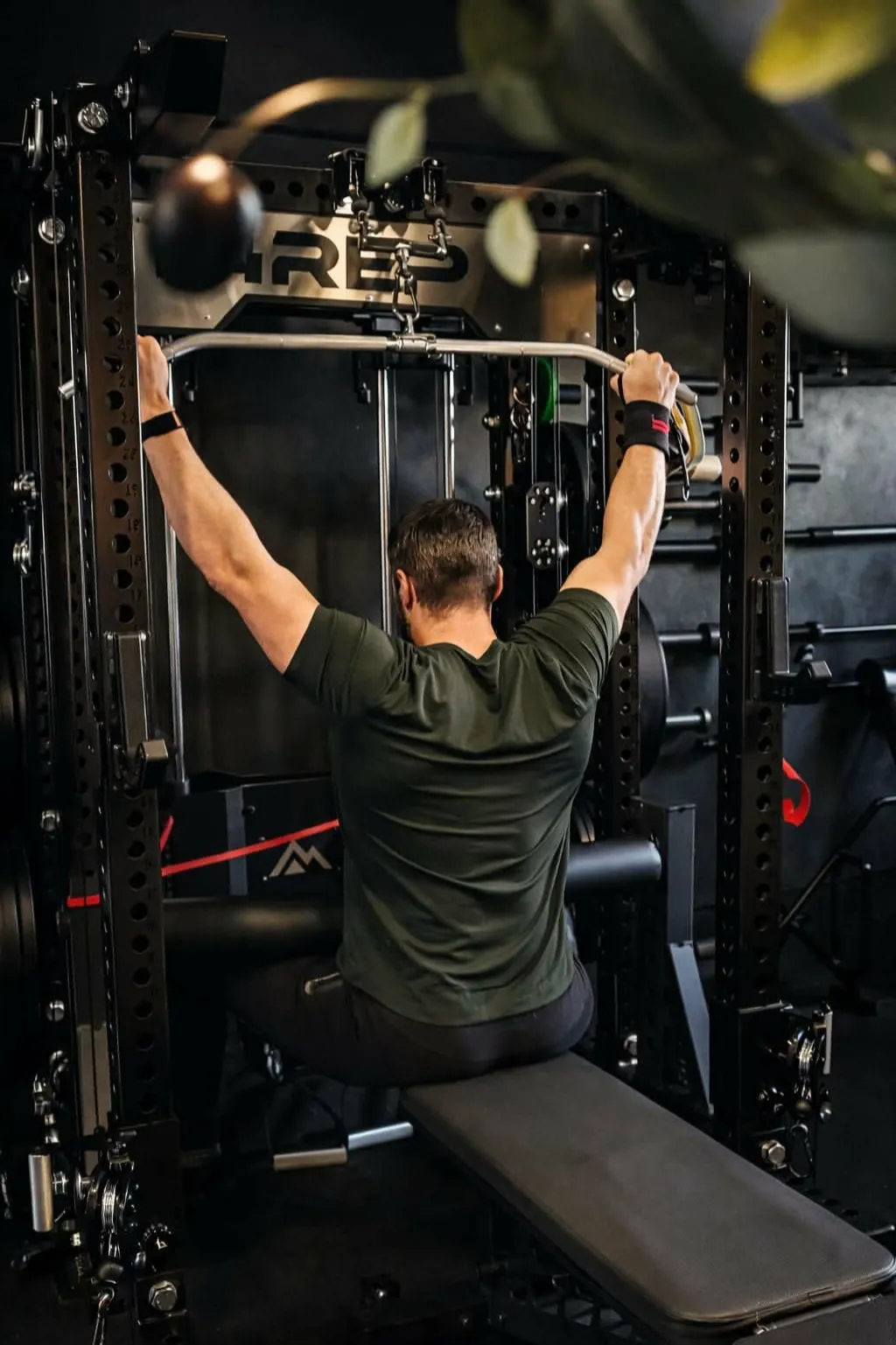 Coach Ethan demonstrating a cable pulldown at HFS Life