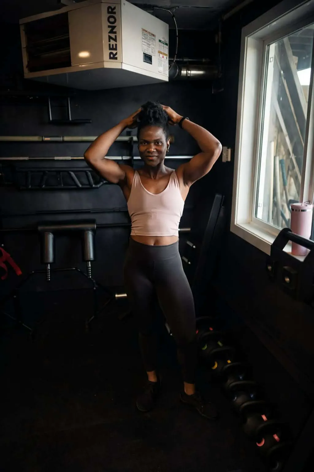 Coach Isatu posing a by weights! 