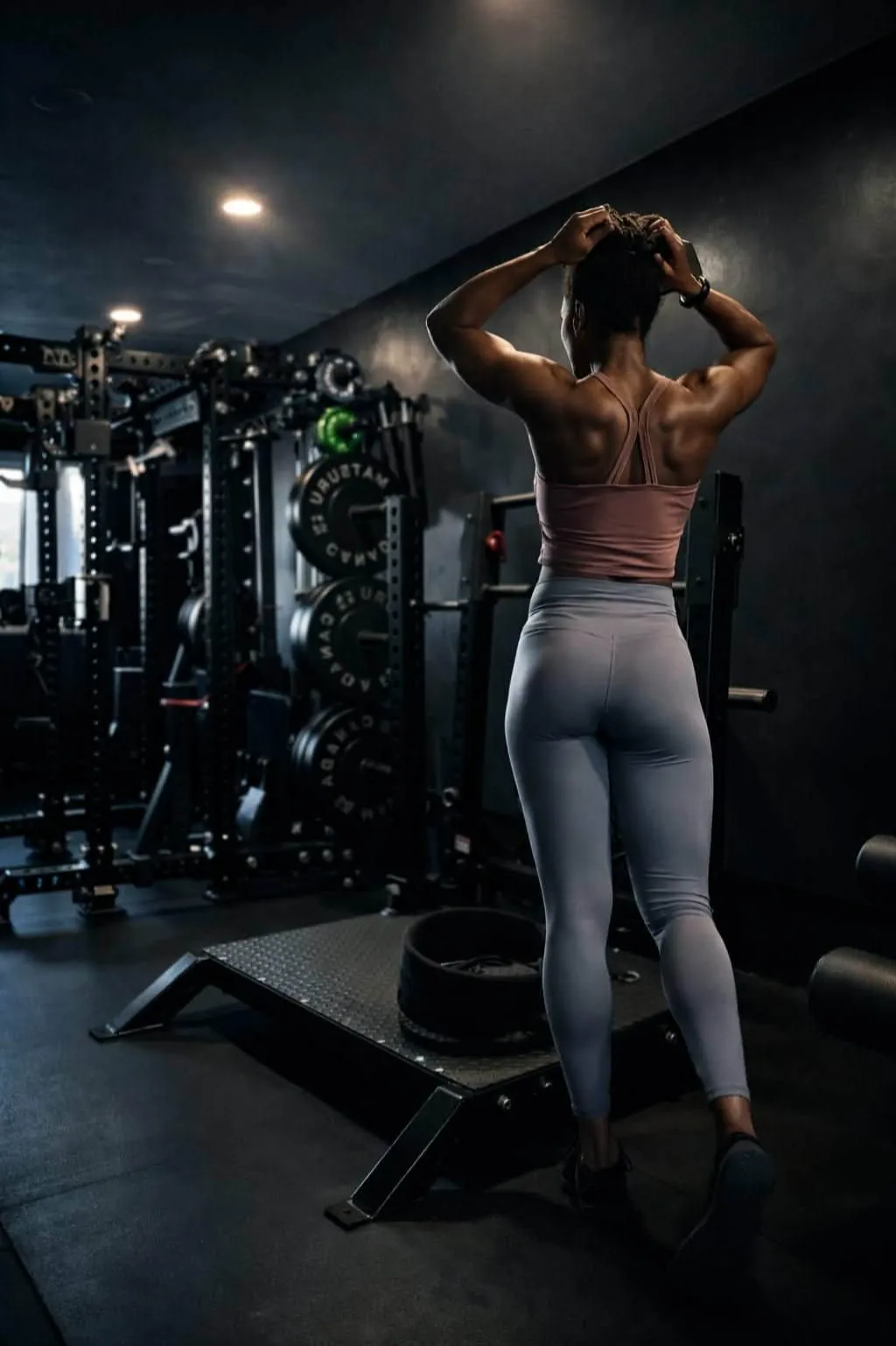 Coach Ice making a pose in HFS Life home gym