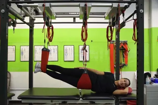 Girl on Redcord Suspension Therapy