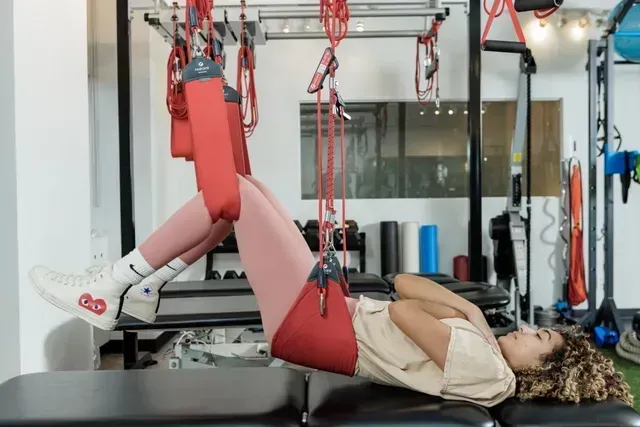 girl on Redcord suspension therapy
