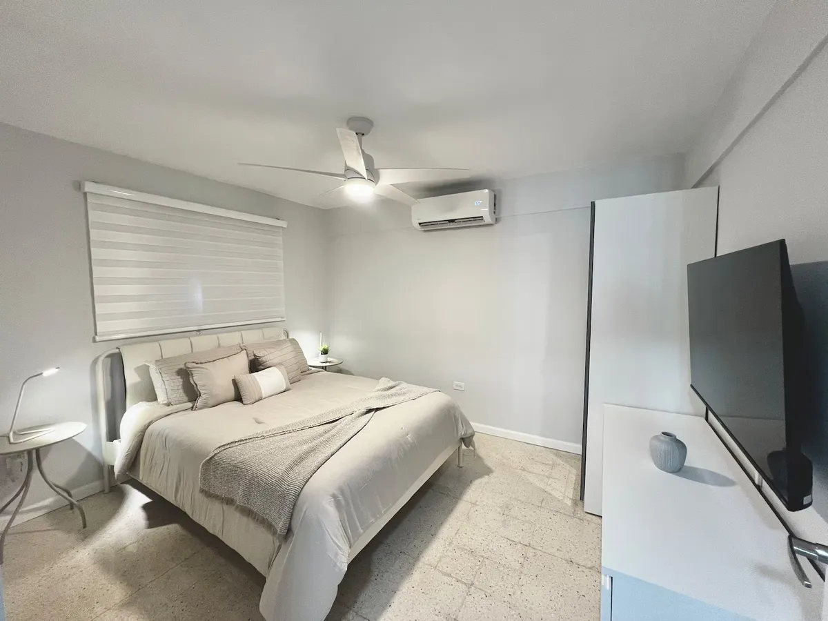 Immaculate master bedroom in luxury coastal retreat with crisp white linens