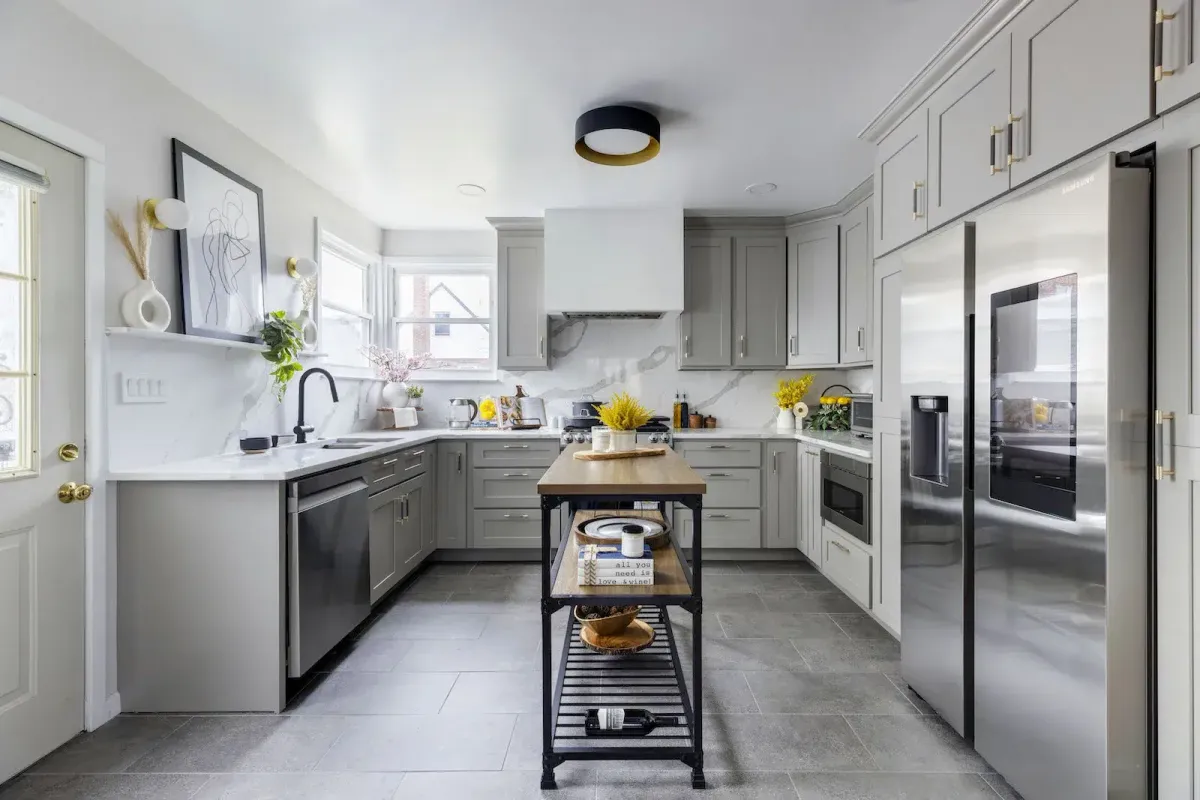 Freehold Kitchen & Bath Remodel team designing an open-concept kitchen with elegant lighting and island seating