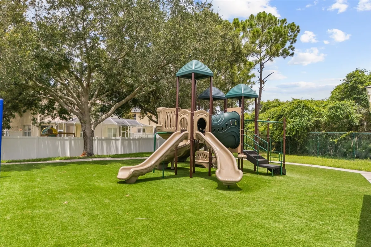 Community playground photograph included with the 13813 Sigler Street listing. This is a shared amenity, not the home’s backyard.
