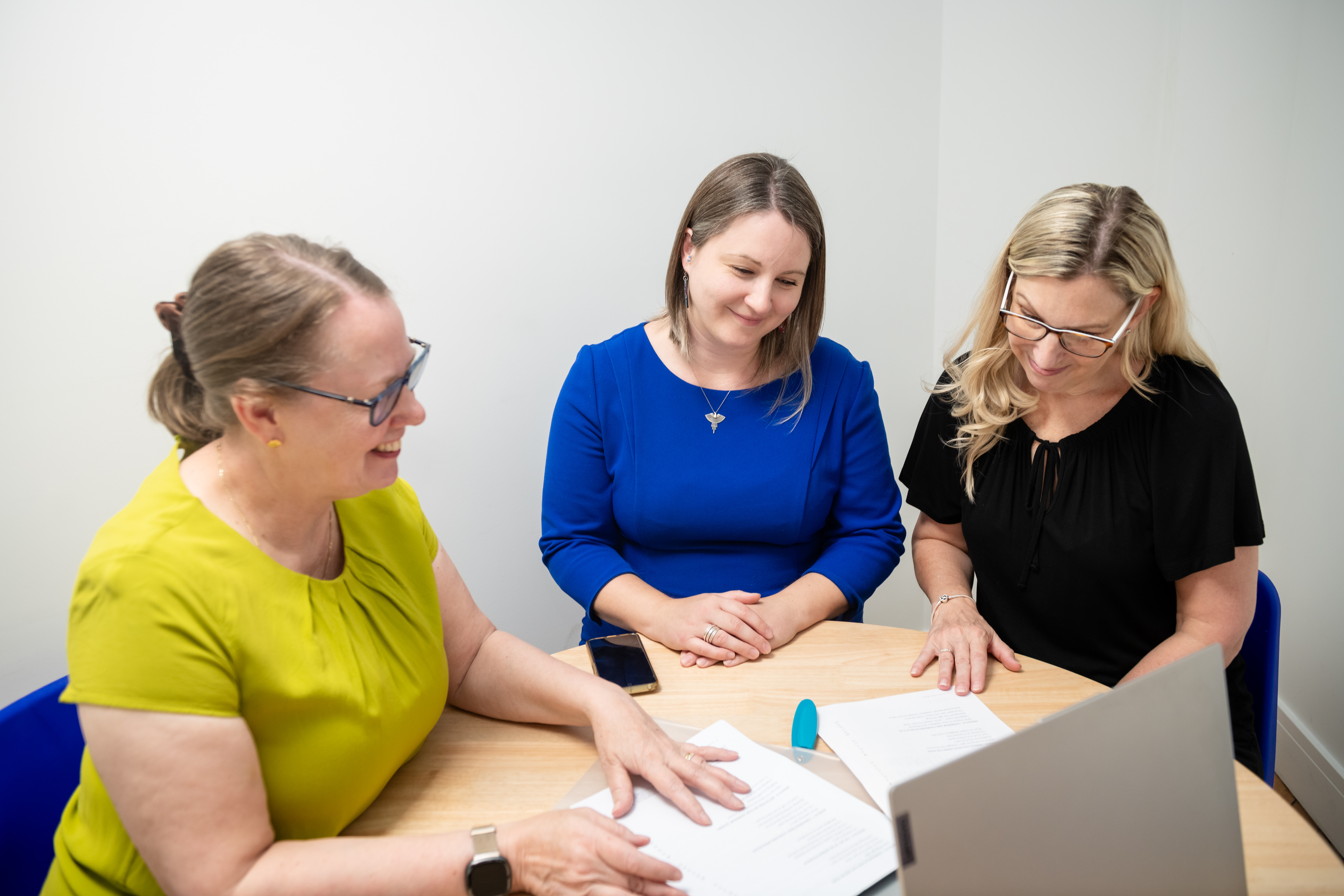 Karen, Georgie and Natalie working on job descriptions