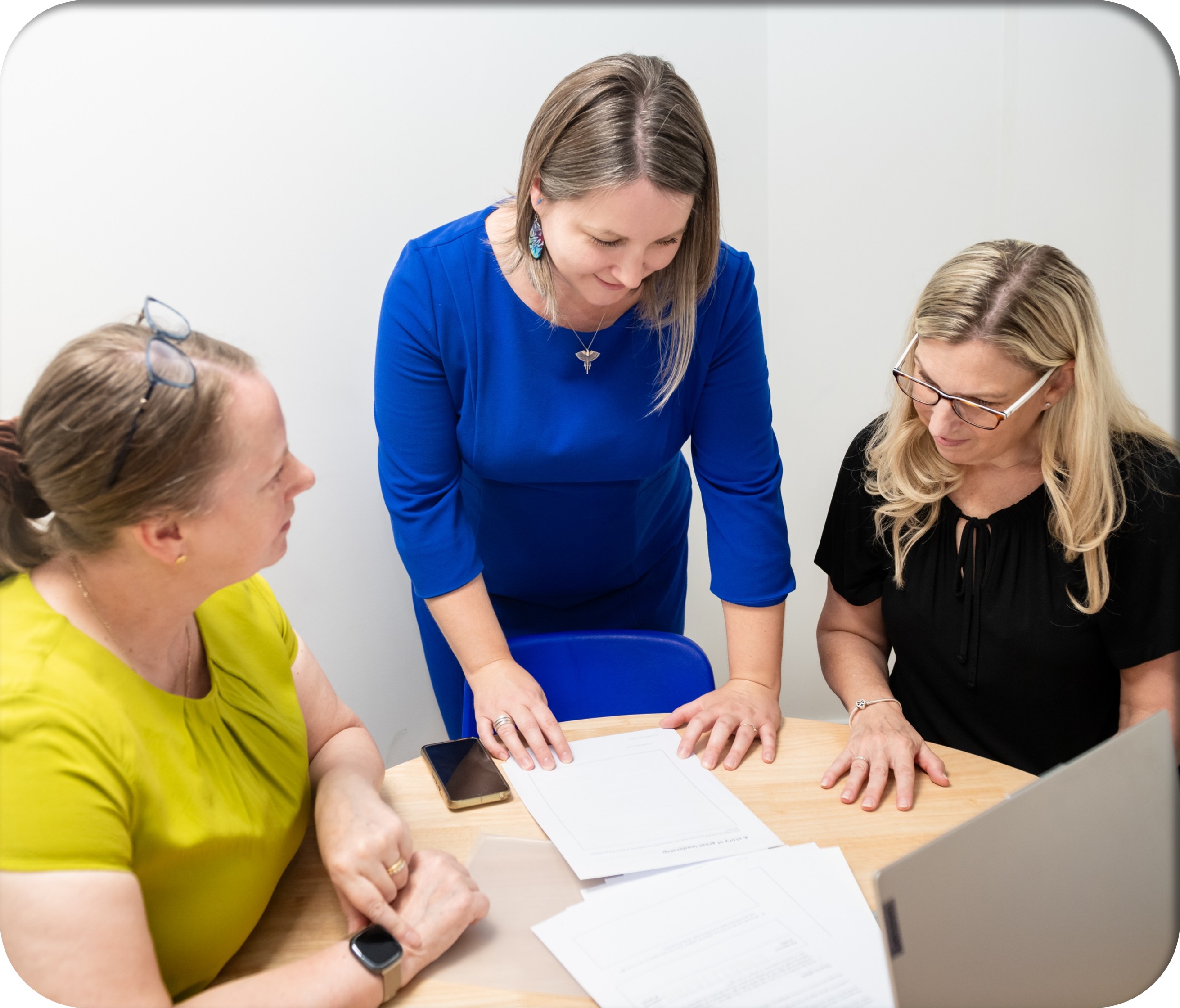 Colleagues reviewing a document together
