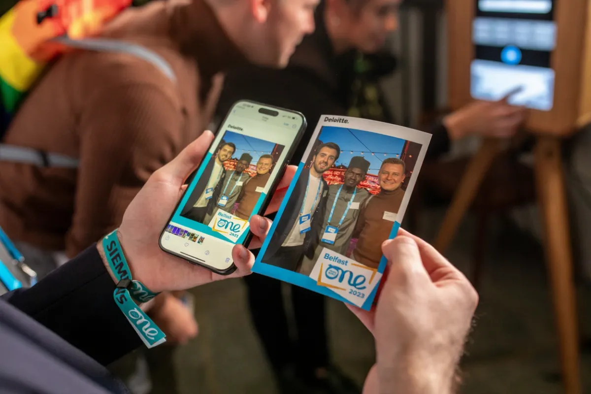 Couple standing on a 360 platform, dancing inside an LED enclosure while the 36 arm spin with a dslr camera attached in Tampa, Florida
