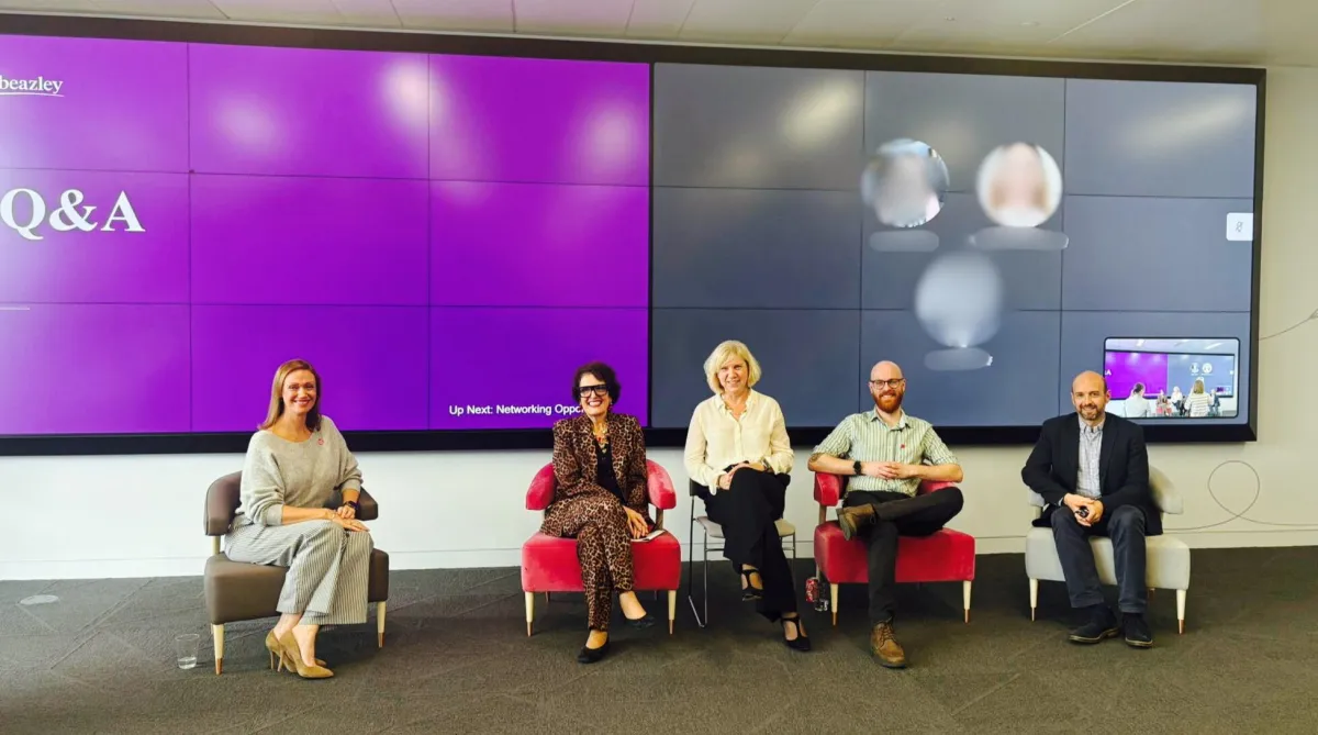 Maisie Cass participating as a panelist in a discussion at a neurodiverse families event.