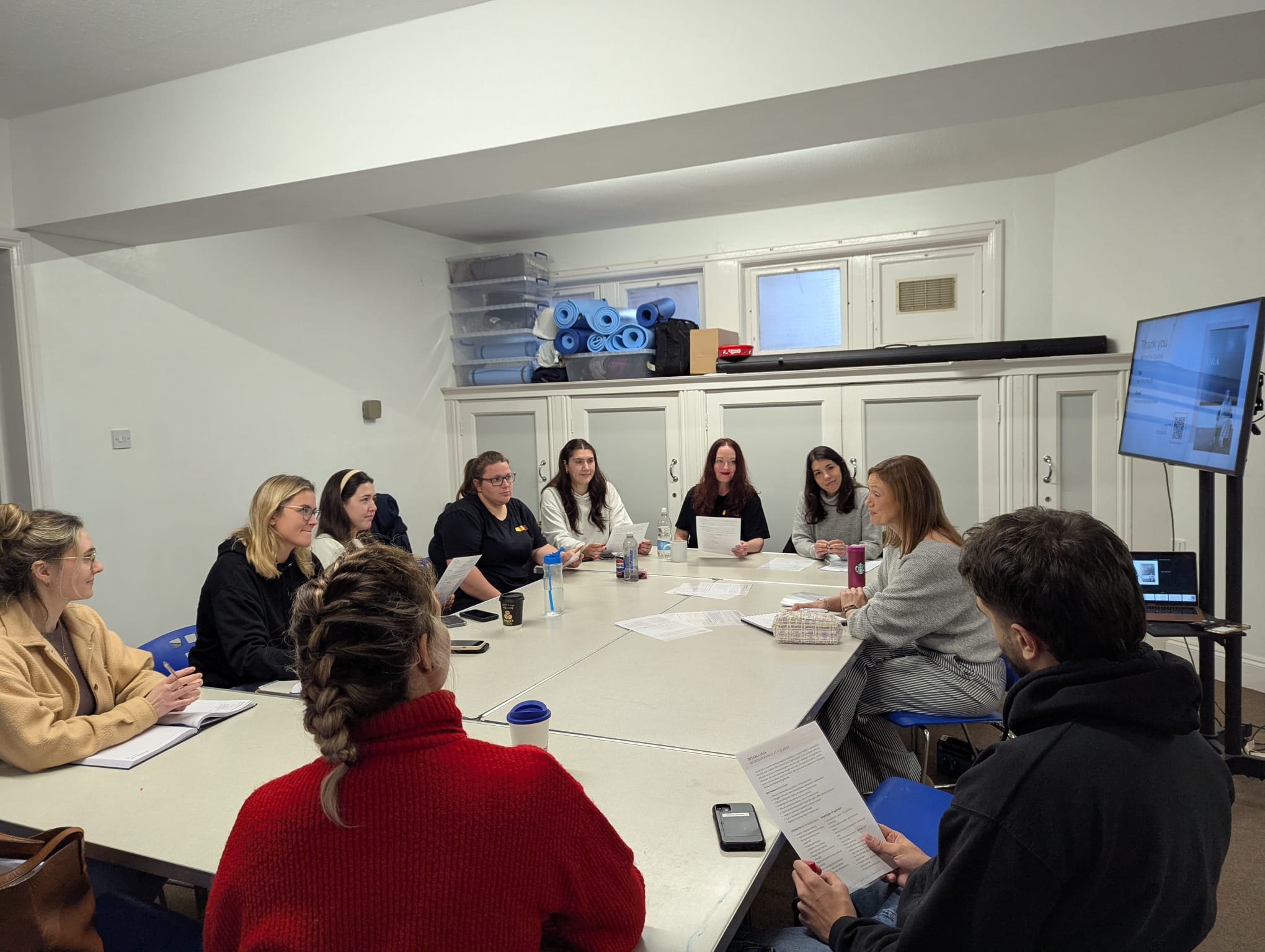 Participants in a Neurodiversity in Education training session with Maisie Cass facilitating.