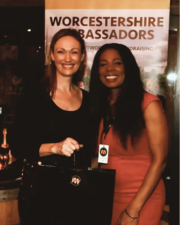 Maisie being presented with her members pack by the Chair of Worcestershire Ambassadors