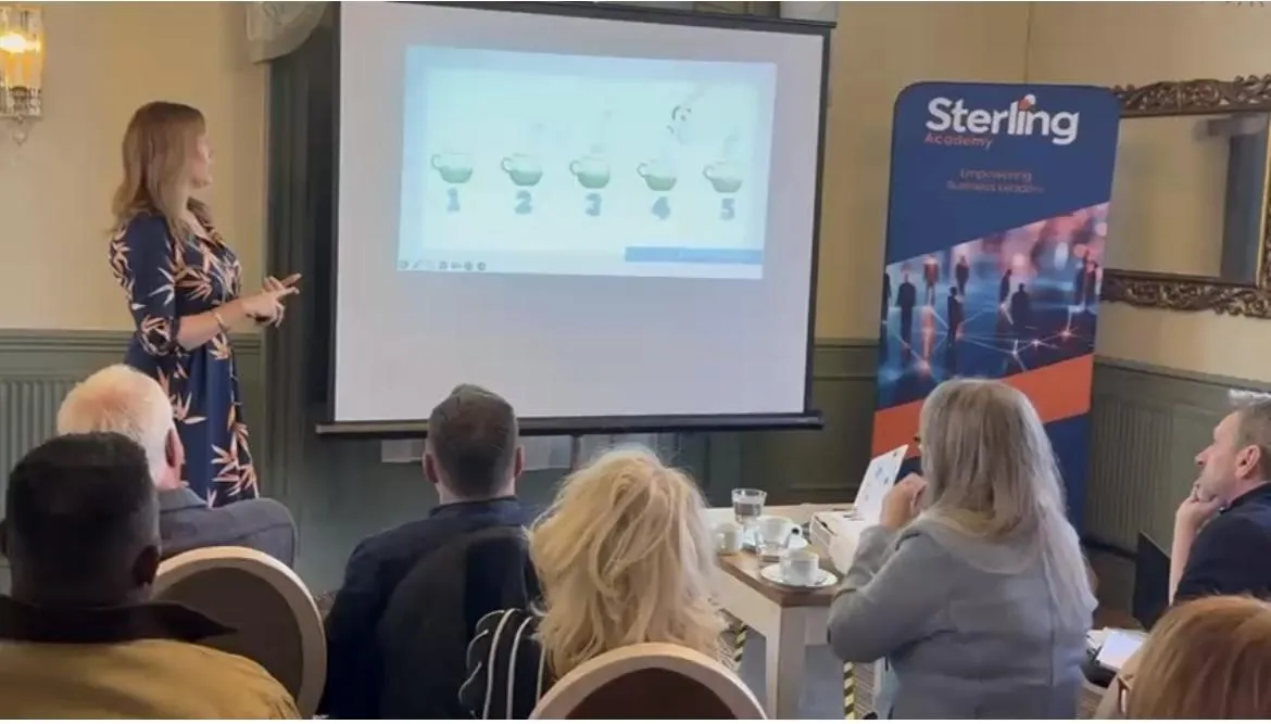 Maisie delivering a keynote session at the Sterling Academy Business Conference