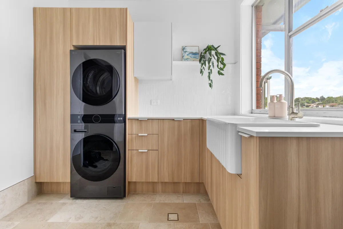 a bathroom with two sinks and a large mirror