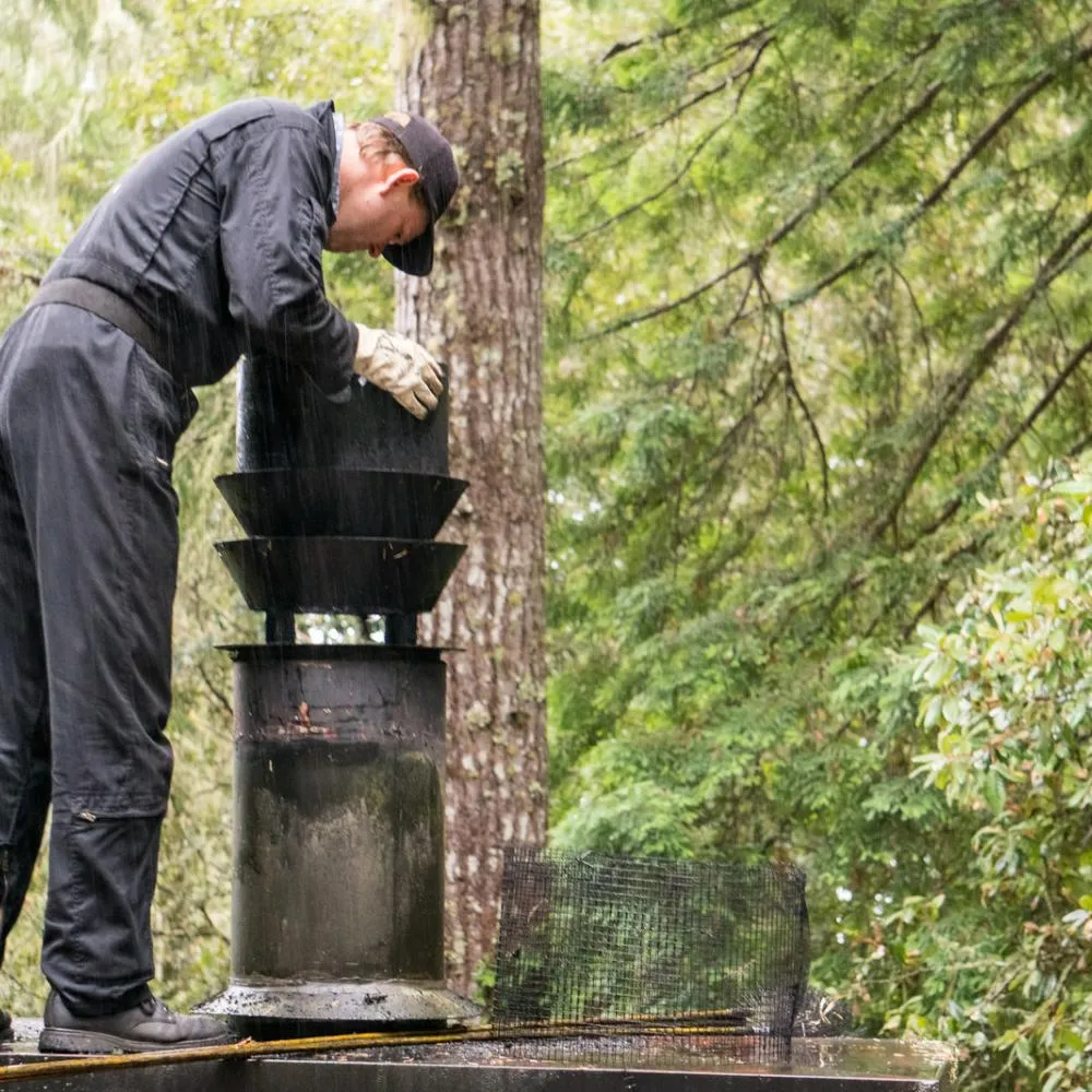 Worker inspecting a chimney