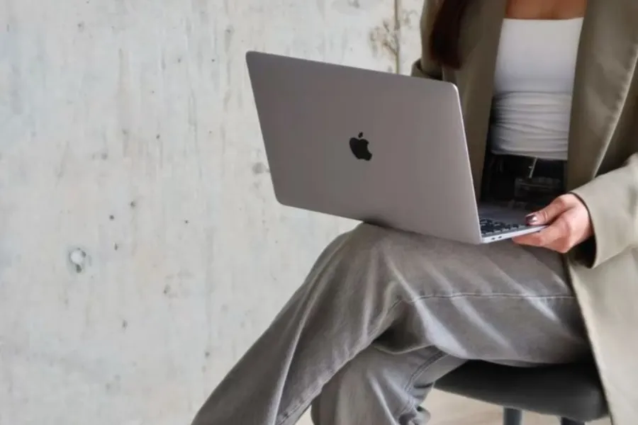 a close up of a brooch with a pearl